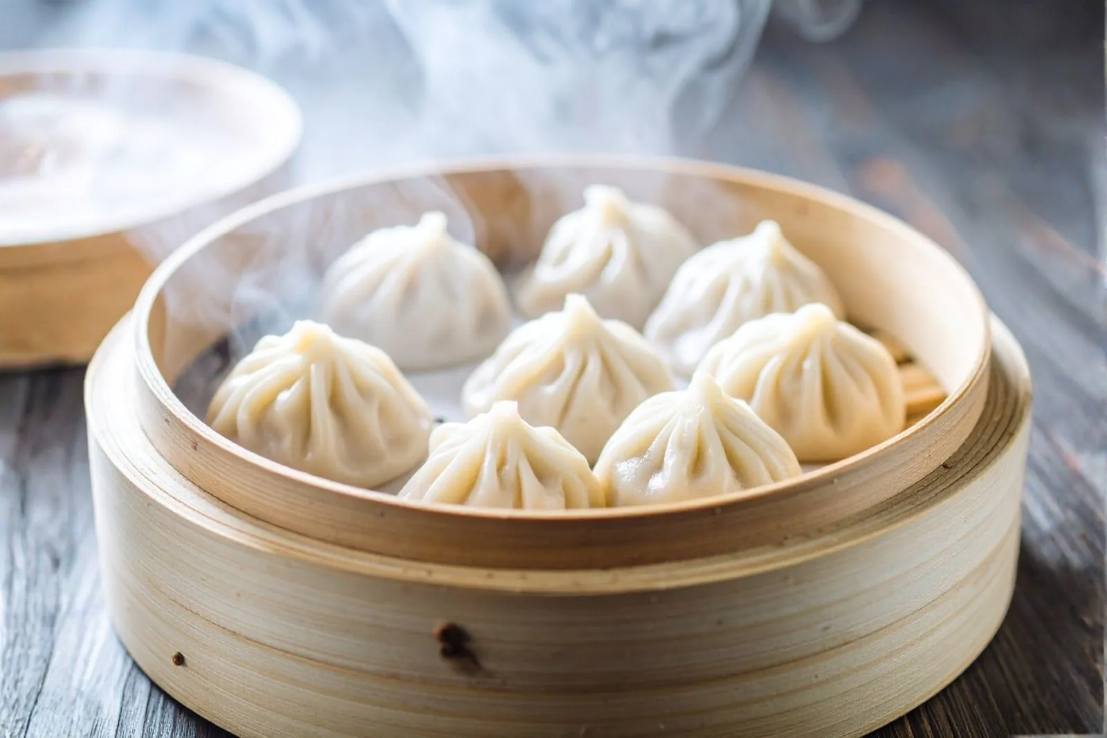 Steamed soup dumplings with juicy broth inside at A One Dumplings & Noodle Bar, a Chinese Restaurant in Bee Cave